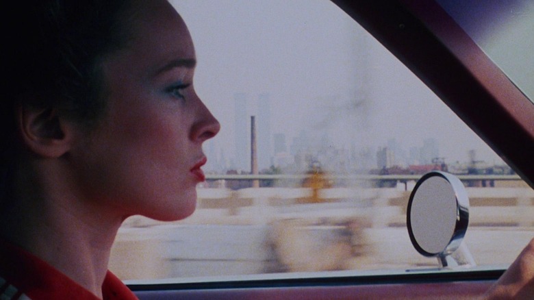 Camille Keaton driving along the NYC skyline in I Spit on Your Grave
