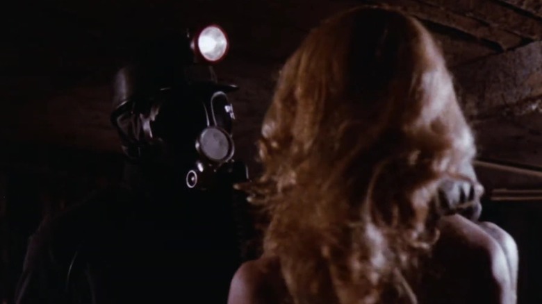 Harry Warden in mining gear approaching a woman in My Bloody Valentine