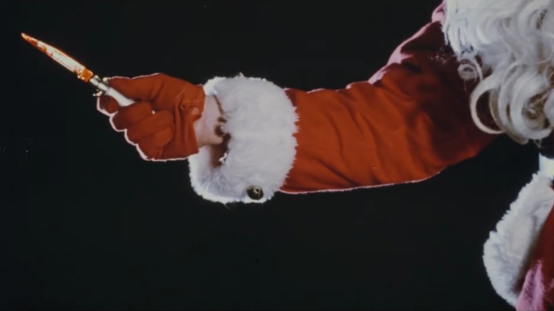 Santa holding out a bloody knife in Silent Night, Deadly Night
