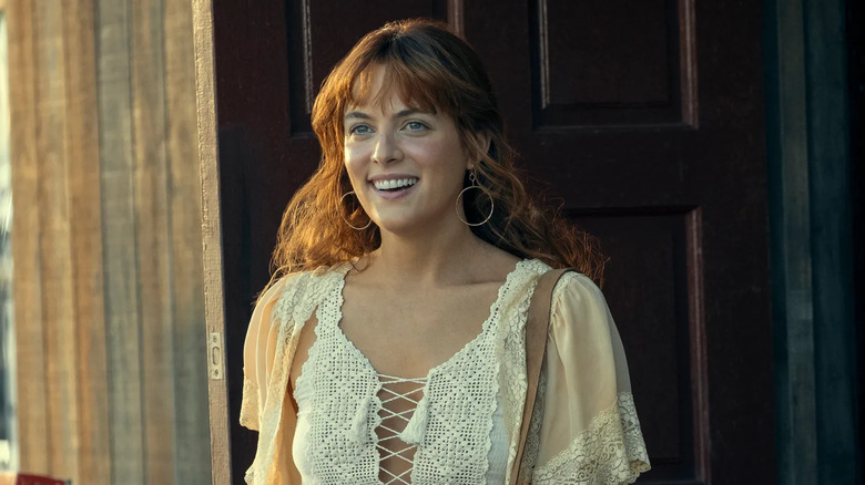 Daisy Jones smiling white top