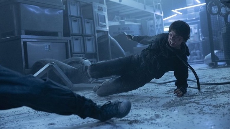 Joey slides across the floor with a knife in Cleaner (2025)