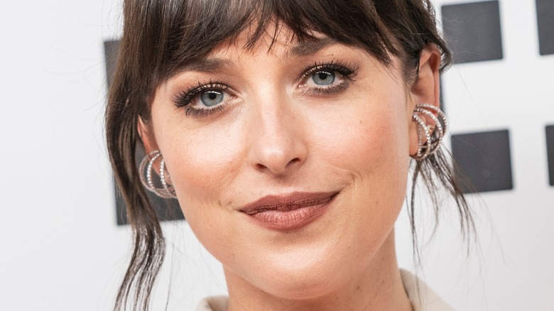 Dakota Johnson smiling on red carpet