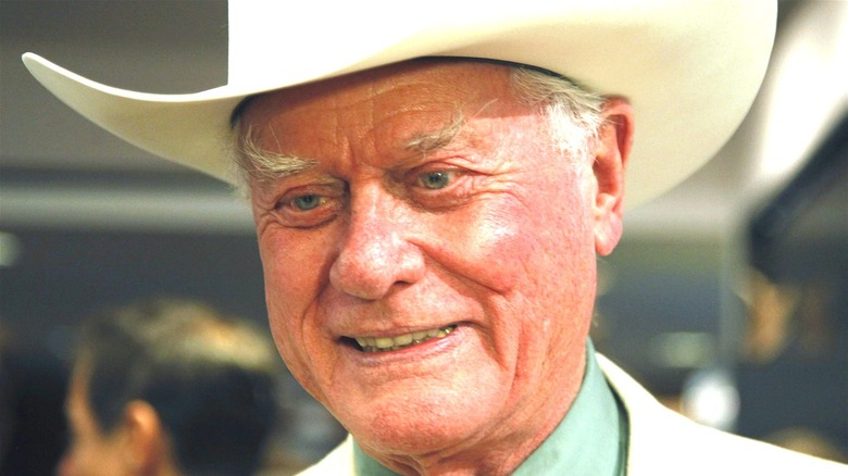 Larry Hagman wearing white cowboy hat