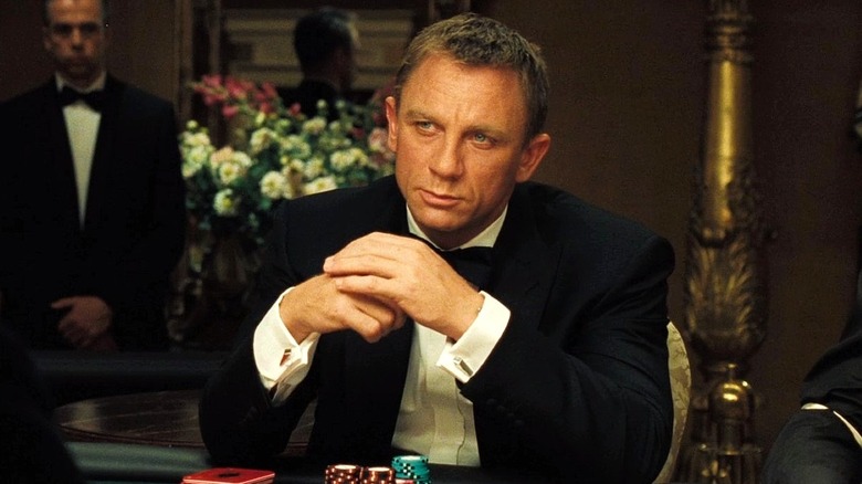 James Bond sits at a poker table