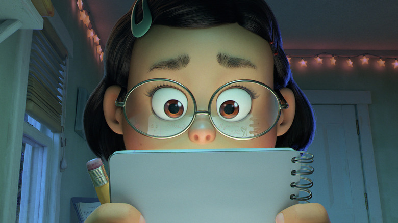 Mei looking at her notebook