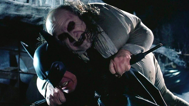 The Penguin attacking Batman in Batman Returns