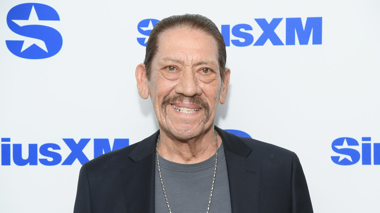 Danny Trejo wearing dark blazer