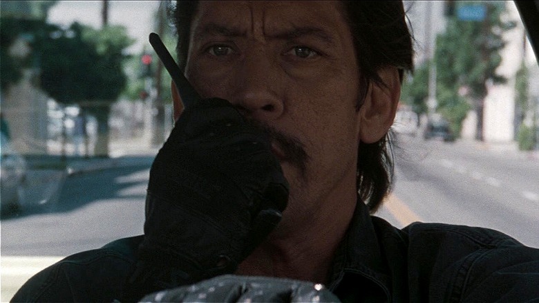 Trejo talking on walkie-talkie in Heat