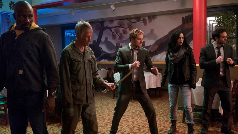 Marvel's Defenders standing in a lineup in "The Defenders" (2017)