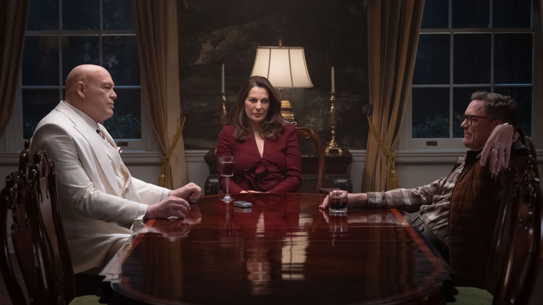 Wilson Fisk, Vanessa Fisk, and Mr. Charles sitting around a table in Daredevil: Born Again Season 2