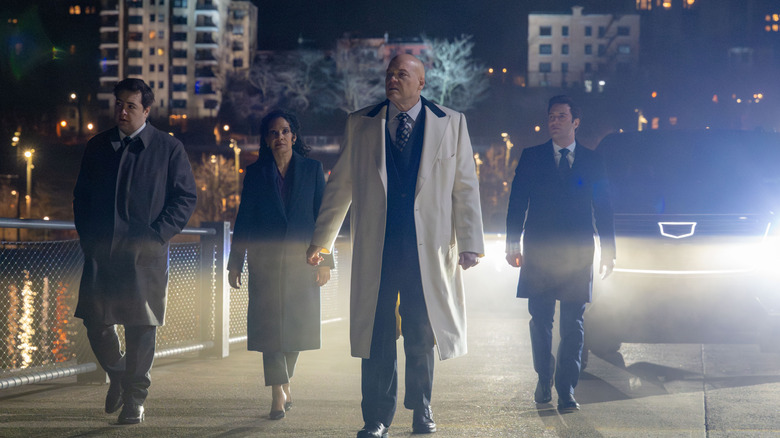 Daniel Blake, Sheila Rivera, Wilson Fisk, and Buck Cashman walking over a bridge in "Daredevil: Born Again" Season 2
