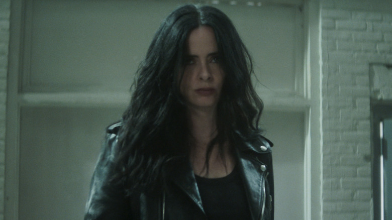 Jessica Jones wearing leather jacket on 
