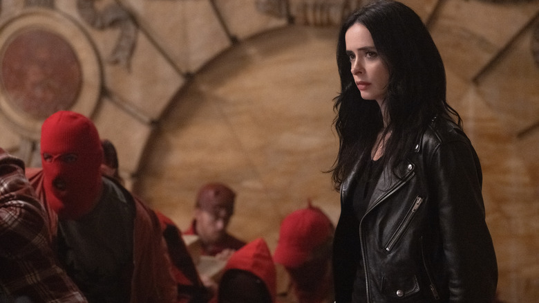 Jessica Jones standing amongst protestors on Daredevil: Born Again