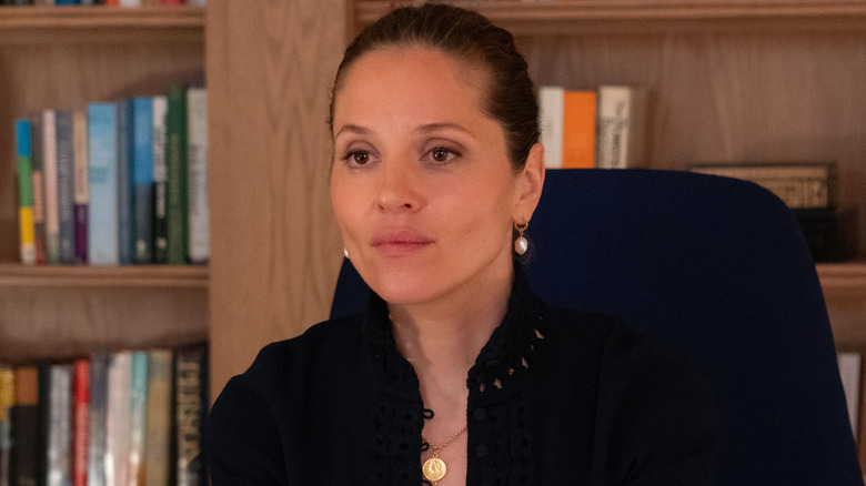 Heather Glenn looking serious and sitting in an office chair in Daredevil: Born Again