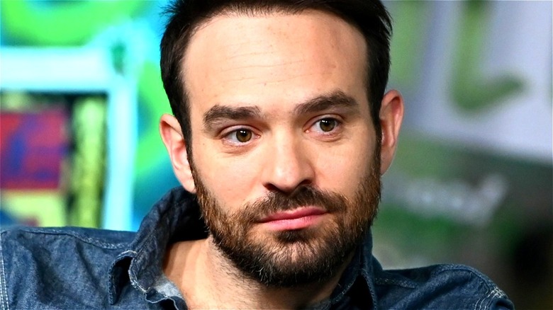 Charlie Cox looking to the side