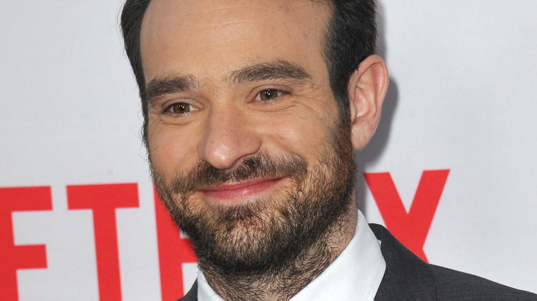 Charlie Cox smiling at event