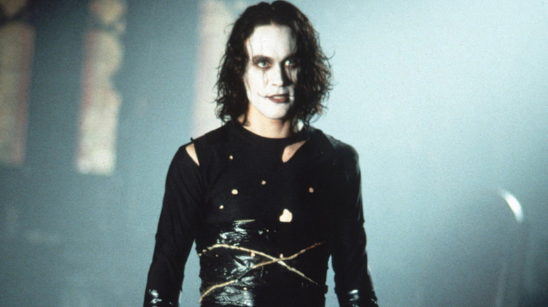 Eric Draven wearing black clothes and white makeup in The Crow