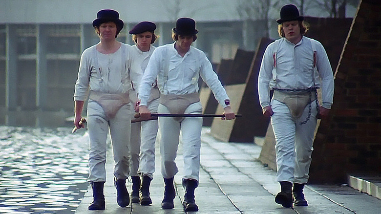 Droogs walk along the water by the Thamesmead Estate in "A Clockwork Orange" (1971)