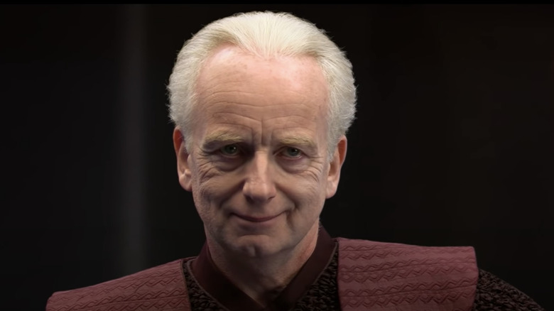 Palpatine smiling at Anakin Skywalker