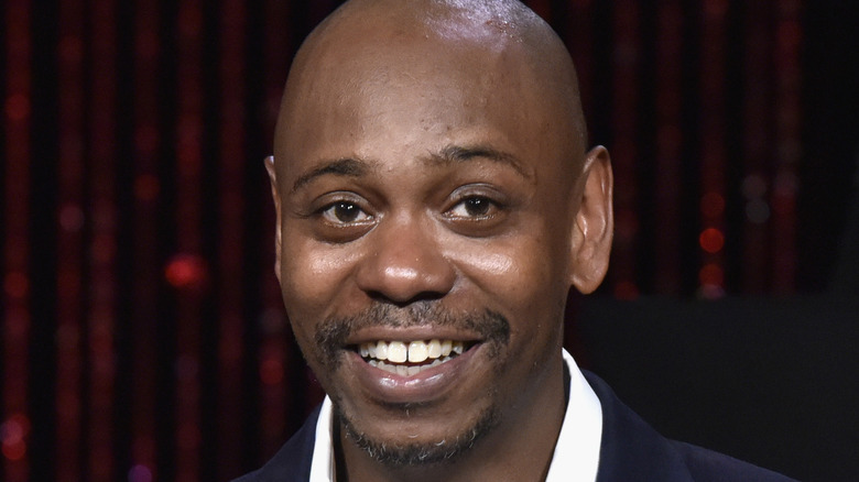Chappelle smiling