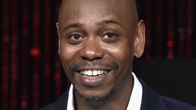 Chappelle smiling
