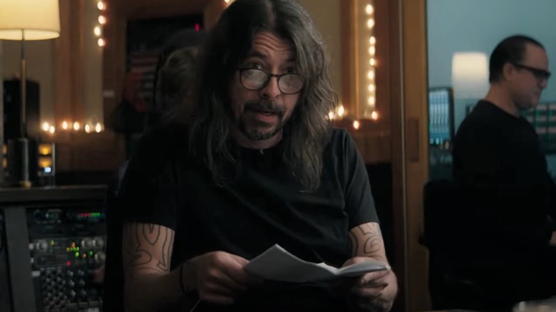 Dave Grohl looking up over glasses