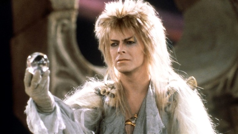 Jareth the Goblin King holding a crystal orb in Labyrinth