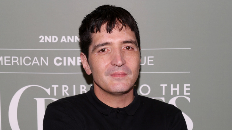 David Dastmalchian posing at event in black shirt