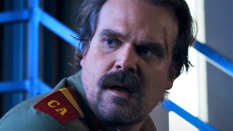 Jim Hopper Stranger Things looking worried