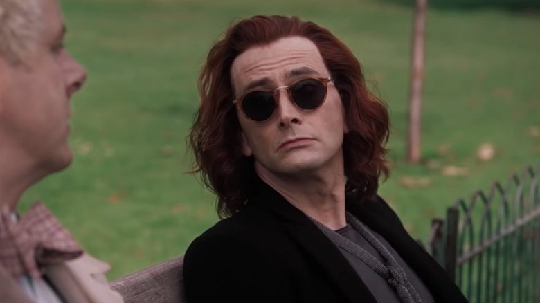 Crowley sitting on a bench