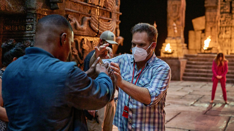 Jamie Foxx and J.J. Perry talking on the set of Day Shift