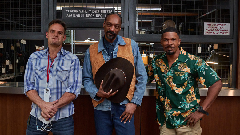 J.J. Perry, Snoop Dogg, and Jamie Foxx posing on the set of Day Shift