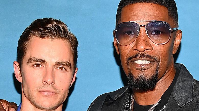 Dave Franco and Jamie Foxx posing at event