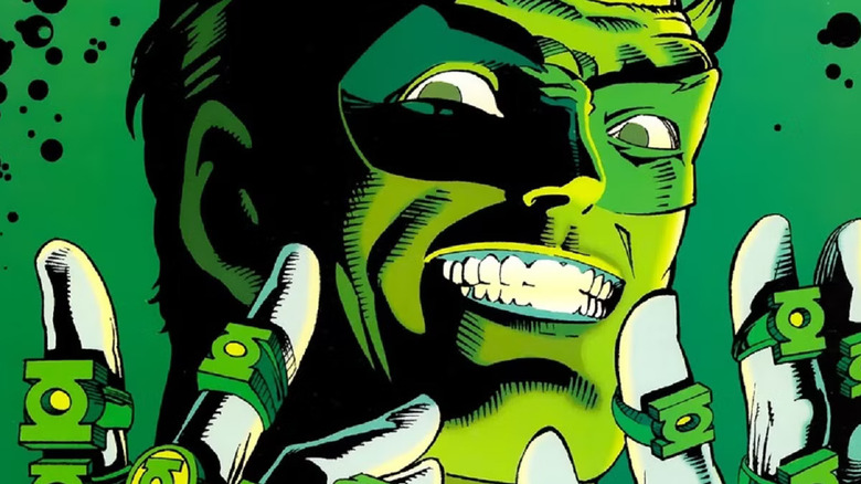 A maniacal, greenlit Hal Jordan/Green Lantern holding up his hands to display the many Green Lantern rings he took during the events of Emerald Twilight (cover image)