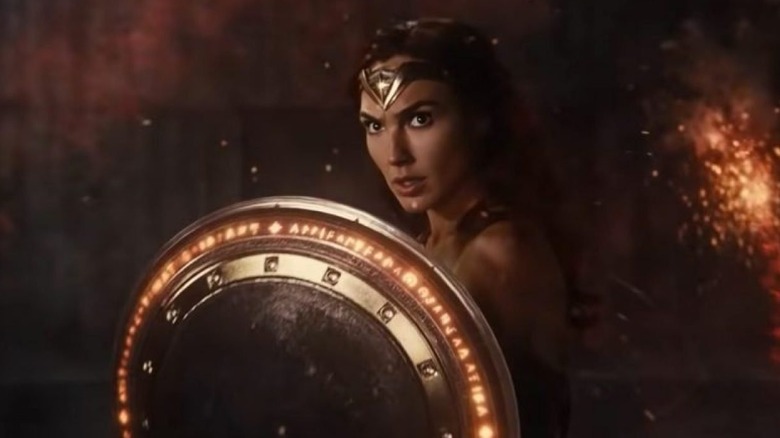 Wonder Woman raises her shield