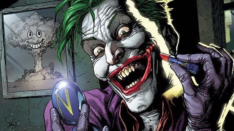 Joker laughing while applying lipstick