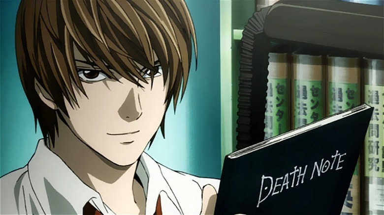 Light smugly holds Death Note in Death Note (2006-2007)