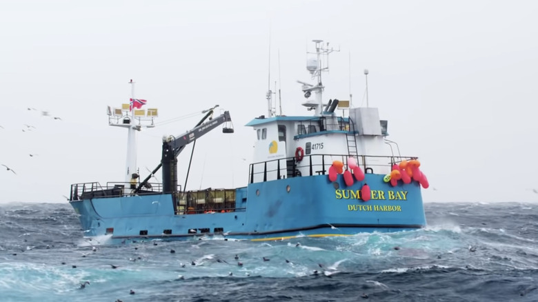 A bright blue crab fishing boat