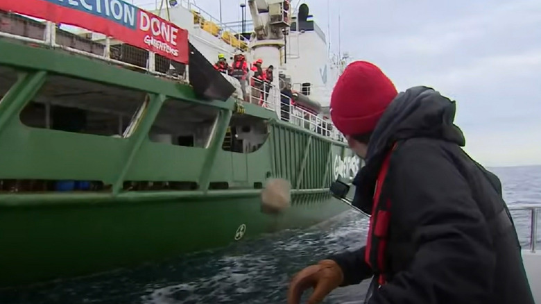Greenpeace dropping boulders into the sea