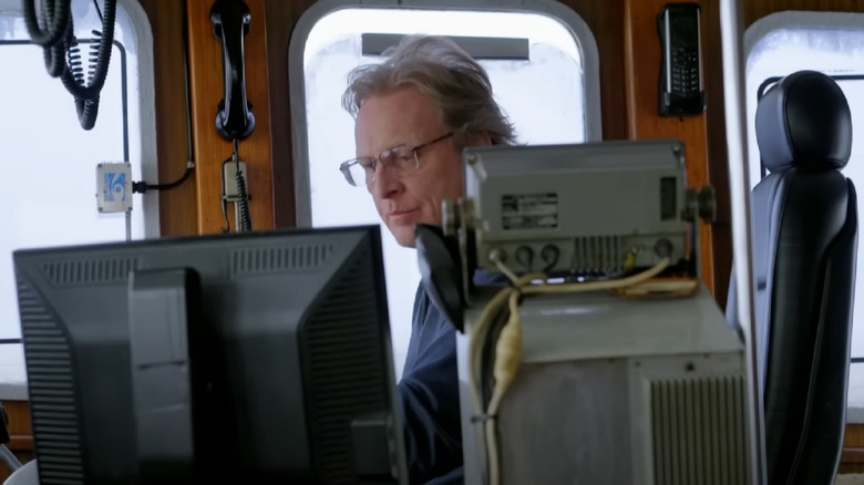 Sig Hansen wearing glasses and looking at computer screen