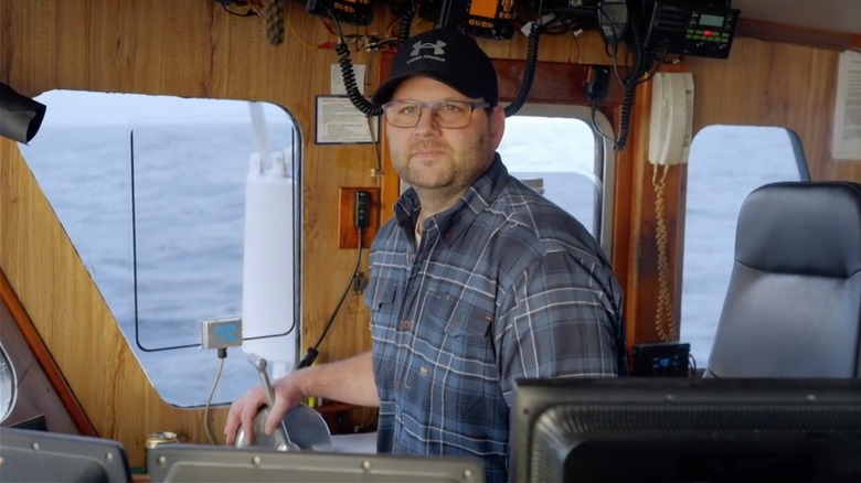 Rick Shelford standing in boat's console
