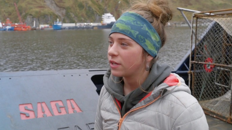 Bob wearing a headband and speaking by the water