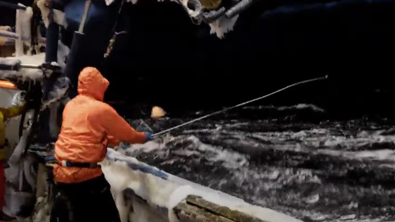 A crewmember on Deadliest Catch fishing in bad weather
