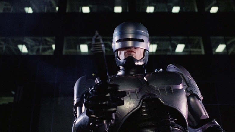 RoboCop pointing a gun