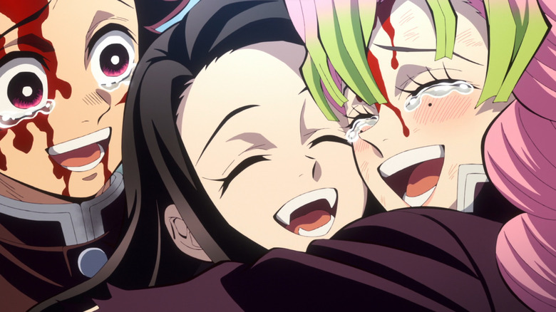 Tanjiro, Nezuko and Mitsuri embrace