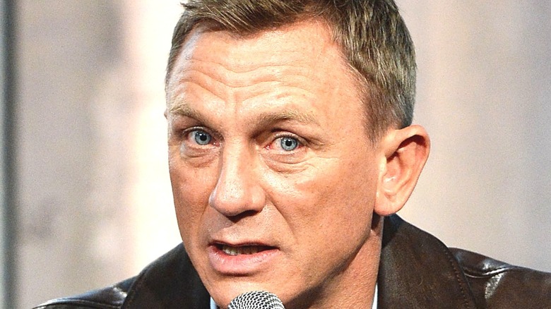 Daniel Craig with a microphone