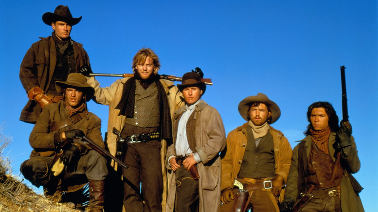 The cast of Young Guns  posing in front of blue sky