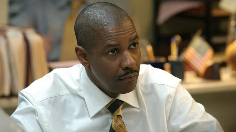 Keith Frazier wearing a white shirt and tie in Inside Man