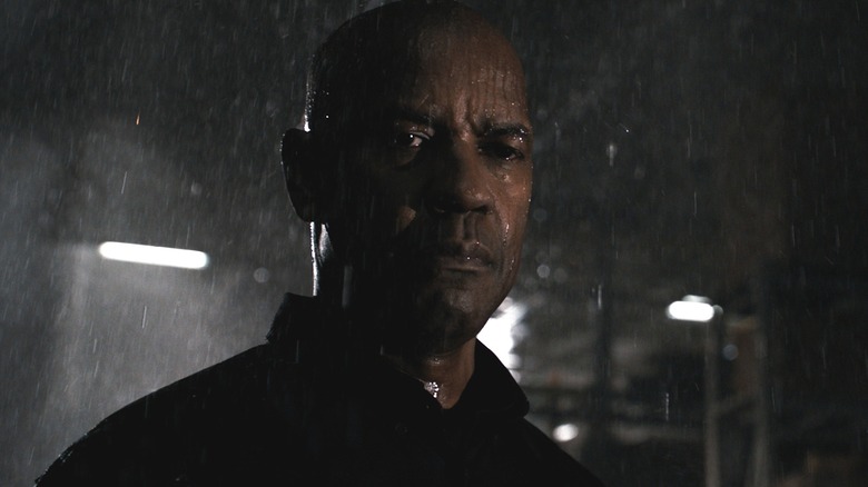 Robert standing in rain sad