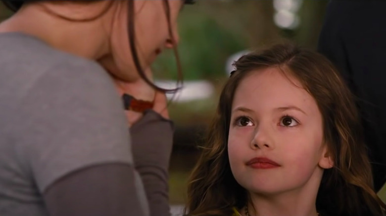Older Renesme touching Bella's cheek